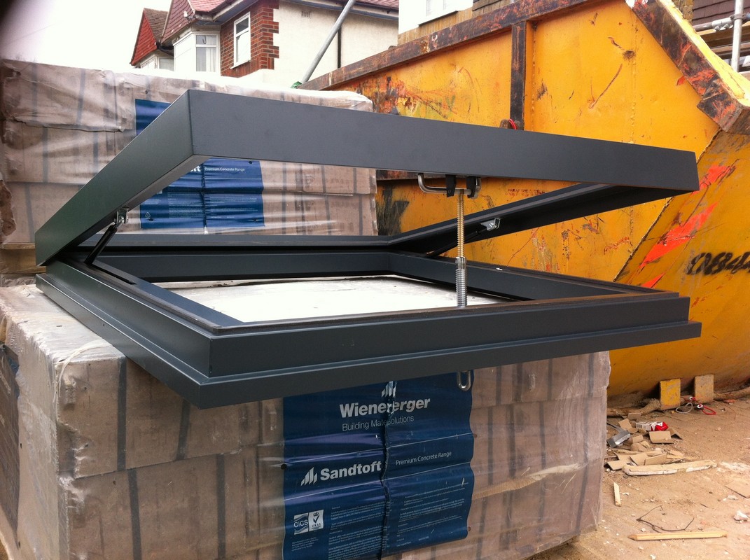 Opening flat roof skylight in anthracite grey installed in Blackheath
