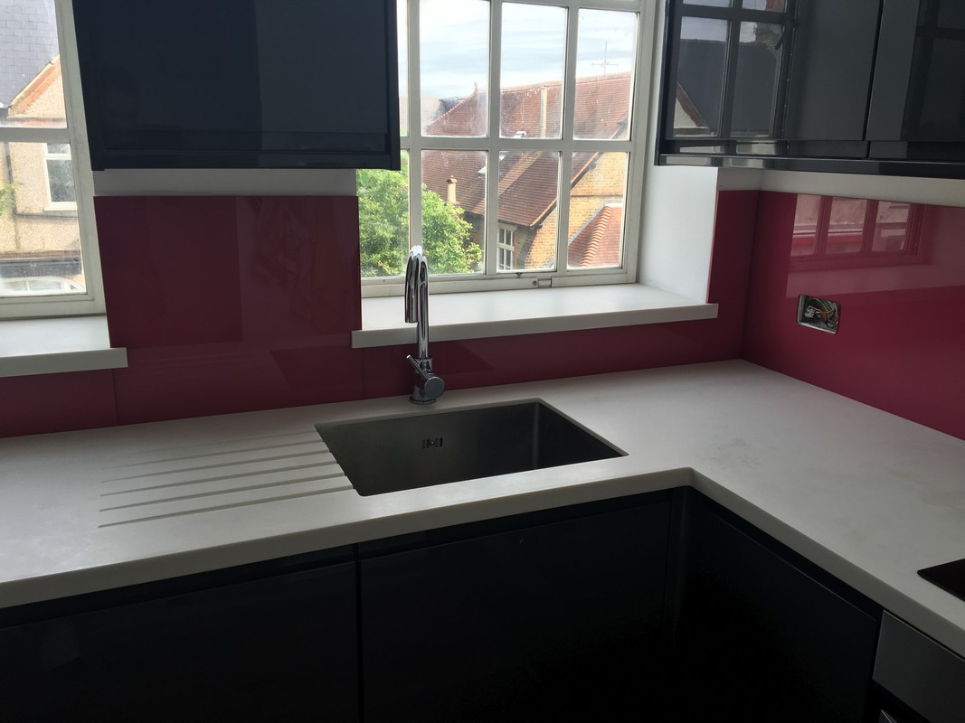 Deep plum coloured glass splashback in modern Blackheath kitchen